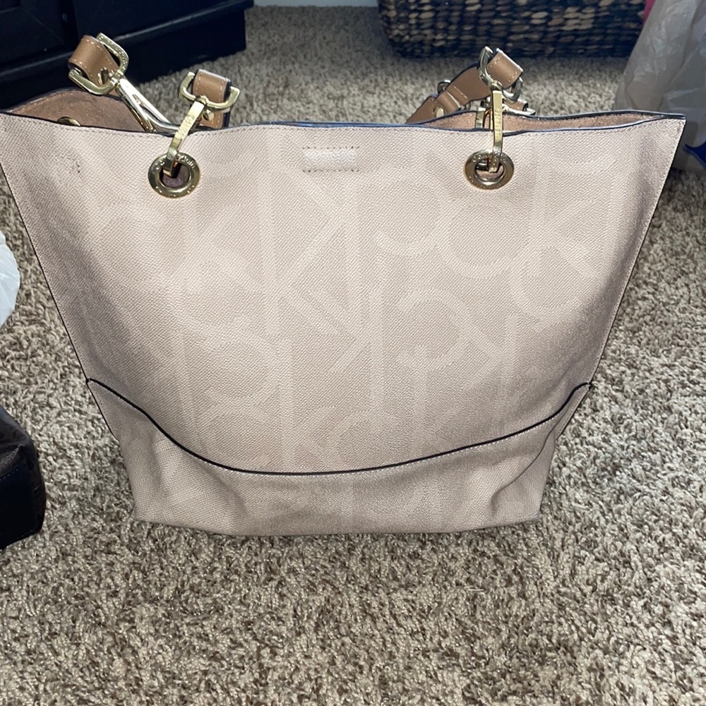 Calvin Klein beige purse. See pictures for size